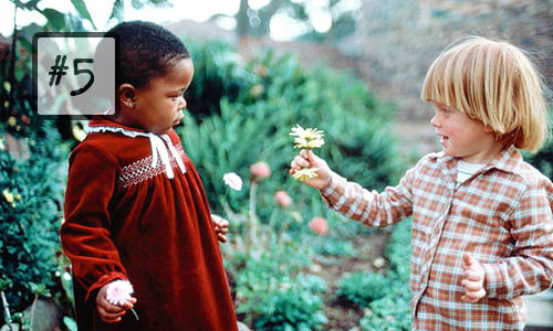 kind children kindness giving flower toddlers black white interracial
