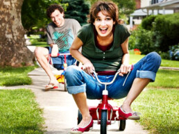 adults riding bikes riding tricycles silly adults